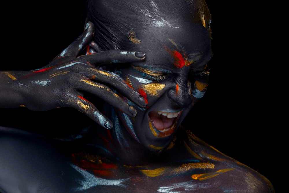 portrait-young-woman-who-is-posing-covered-with-black-paint.jpg